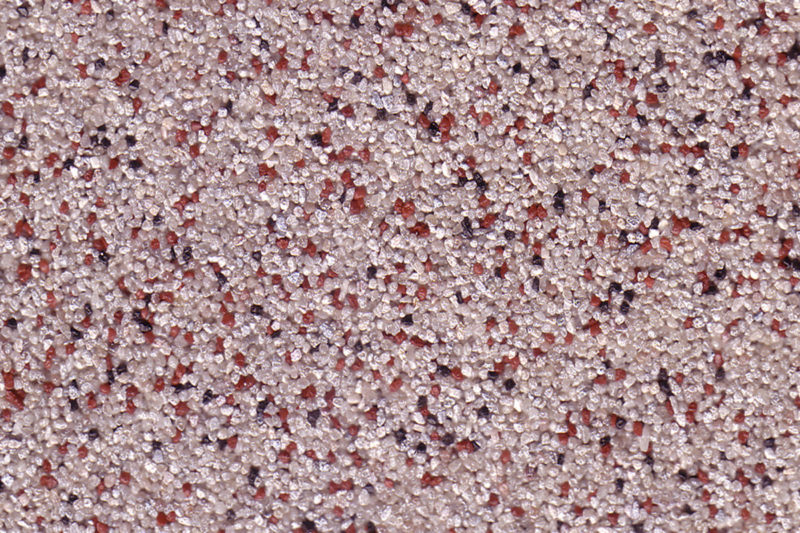 Coloritquarz als Bodenbelag und Einstreuung in der Farbe graphit-oxyd-elfenbein